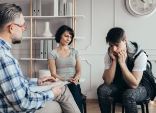 image of three people talking